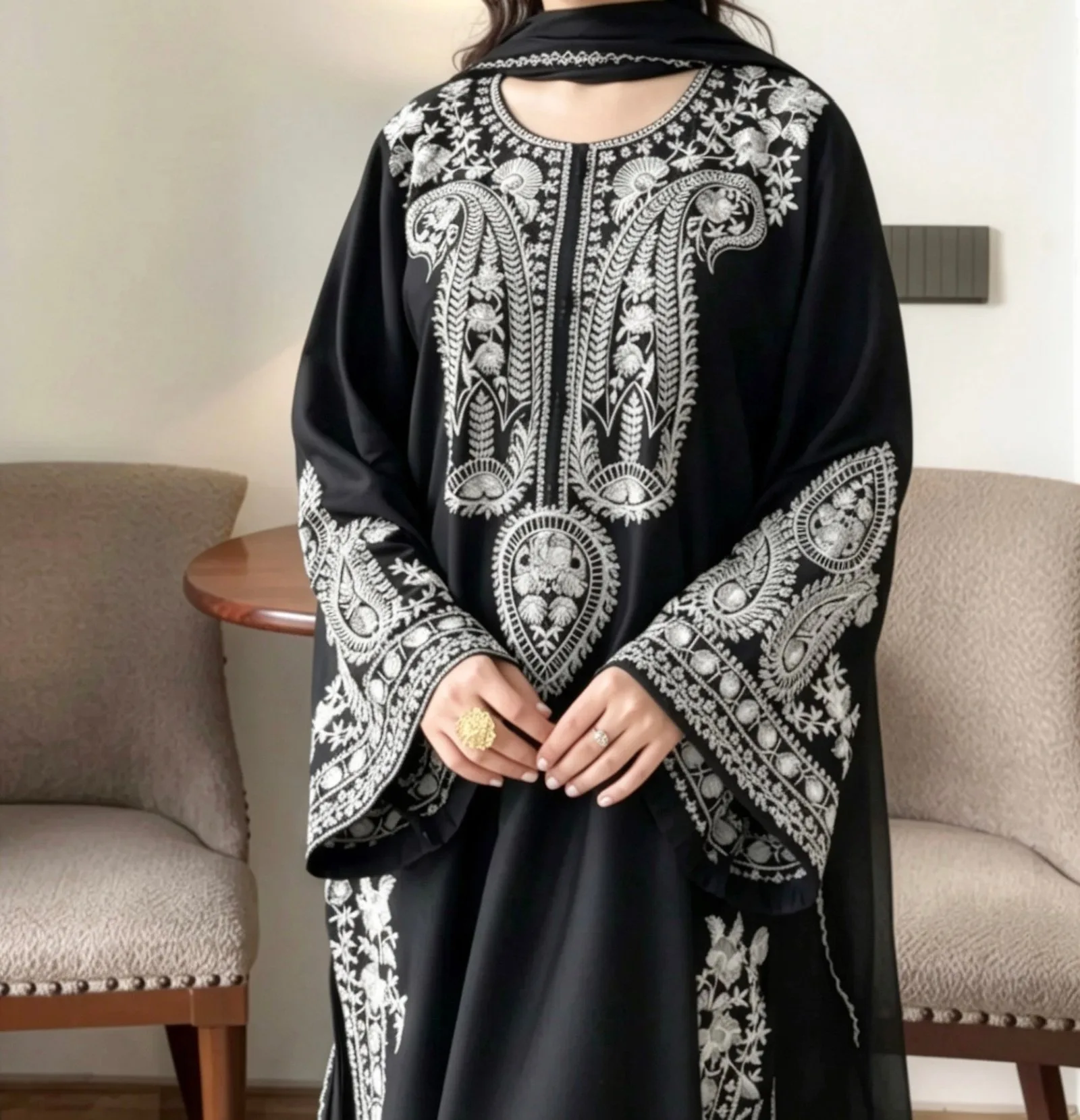 Detail of silver embroidery on the neckline and sleeves of a black lawn kurta by Reshyle
