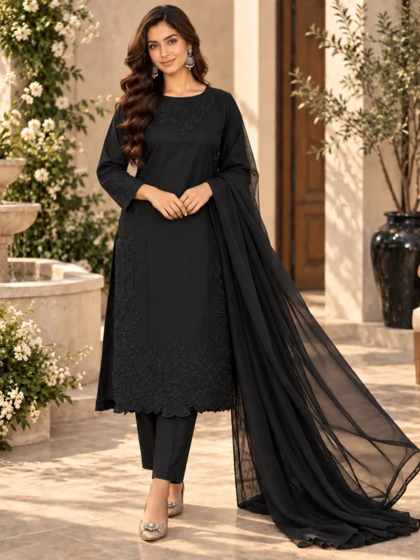 Model wearing black embroidered cotton silk 3-piece stitched suit - front