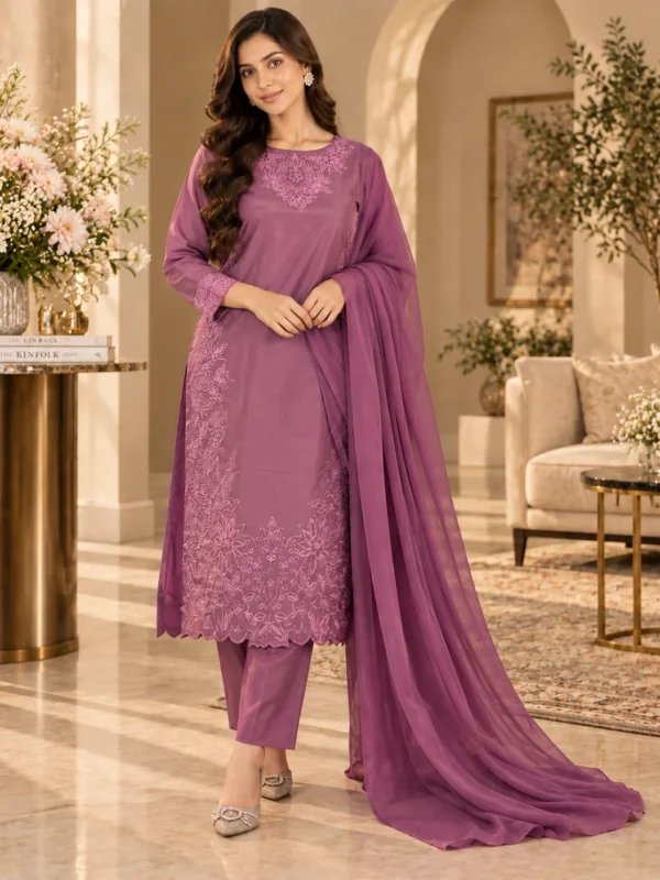 Model wearing mauve embroidered cotton silk 3-piece stitched suit - front
